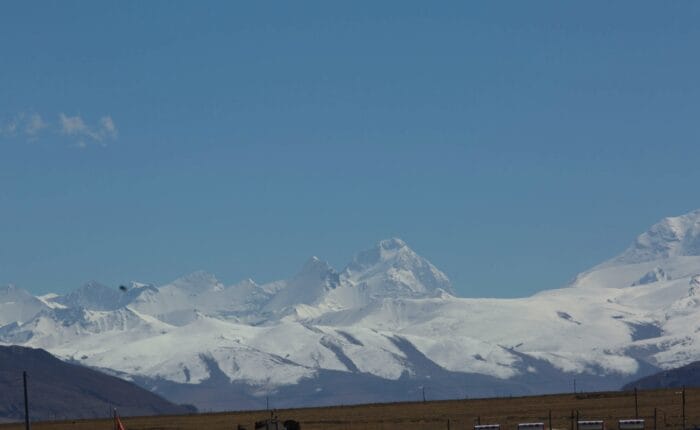 Snow-capped mountains under clear blue sky