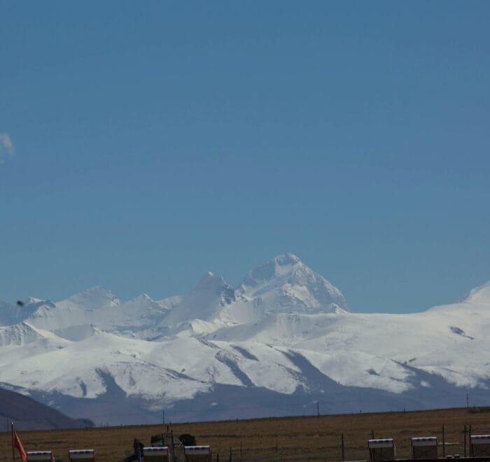 Snow-capped mountains under clear blue sky
